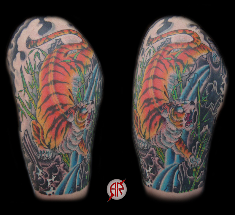 Looking for unique  Tattoos? tiger manuvering through lava rocks