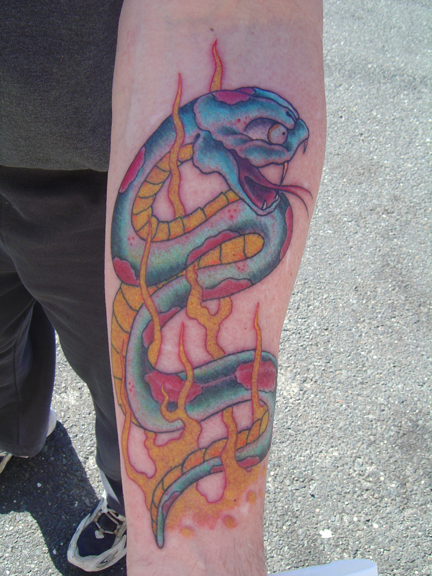 Looking for unique  Tattoos? snake on forearm