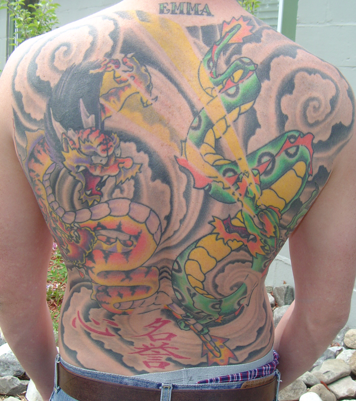 Looking for unique  Tattoos? double dragon backpiece