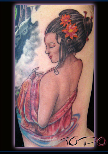 A great example of a pin up girl tattoo. This one is by Lucky Bamboo Tattoo.