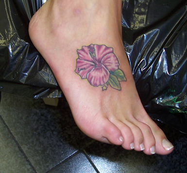 flower foot tattoos. flowers foot body piercing
