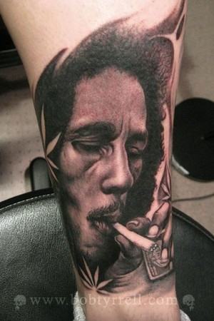 Fernando has tattoos on of both of his inner arms. tattoo bob marley