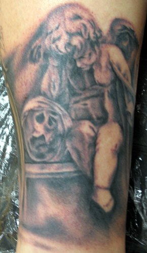 angel holding baby tattoo. Nick Trammel - Baby Holding a