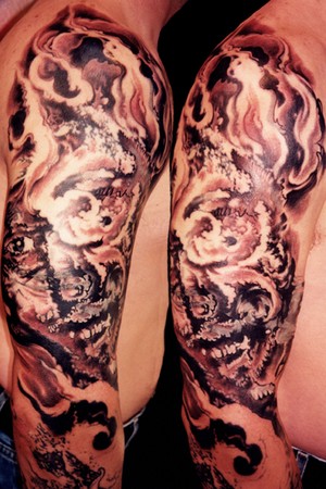 skull tattoo arm. Abstract Arm Tattoo