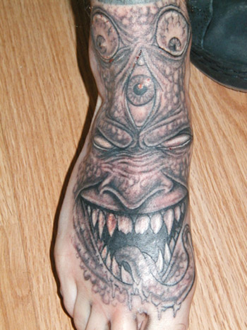 Comments: evil face tattoo on