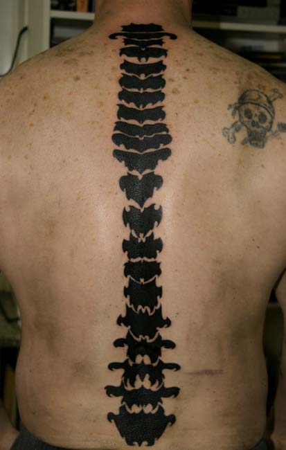 It is Victoria Beckham's Hebrew tattoo on her spine. Spine tribal tattoos