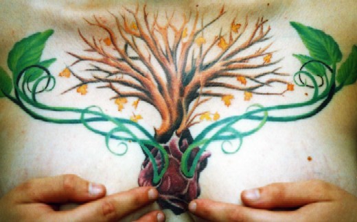 family tree tattoos. Family tree growing out of her