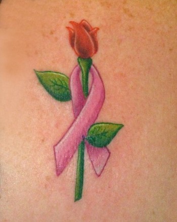 Comments: Breast cancer ribbon and rose on the shoulder of a survivor
