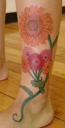 Colorful Gerber daisy tattoo