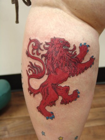 Comments: A red lion rampant symbolizing Scotland, tattooed on the back of