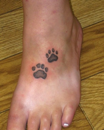 Comments This is the client's actual dog's prints tattooed on her foot