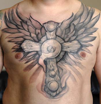 the best cross tattoo with wing tattoo on breast tattoo, breast tattoo, cross tatto, the best tattoo, wing tattoo