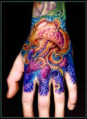 tattoos on hand. jellyfish tattoo on hand.