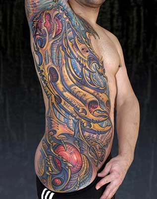Tattoos · Guy Aitchison. Biomech on left side