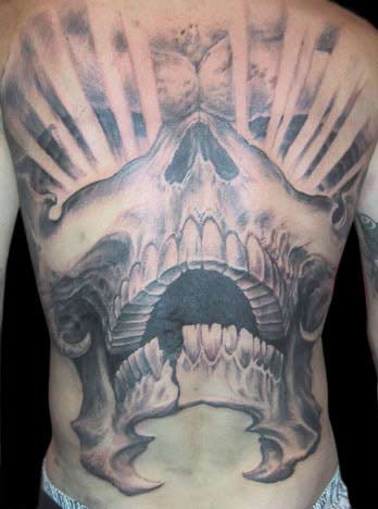 skull tattoo on back. Backwards Skull Tattoo