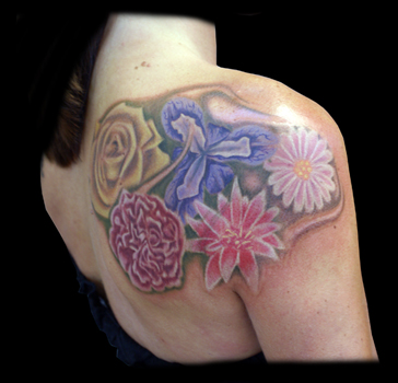 Lilly Tattoo Designs - The whiteness of the lily's long white petals speaks 