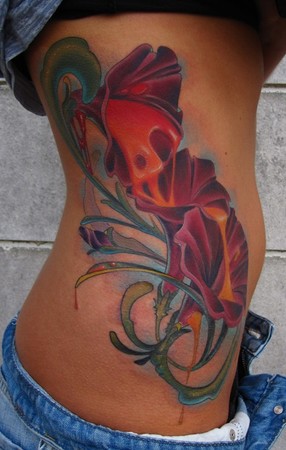 flower side tattoos. glory floral tattoo