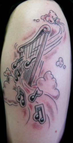 Comments This harp in clouds tattoo was fun to do playful