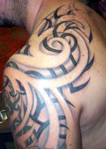 If you're interested in learning more about tribal tattoo designs,