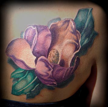 flower tattoos on back. flower color ack tattoo