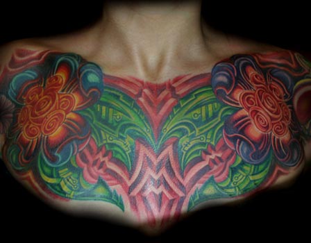 chest piece tattoo. chest tattoo. color flower
