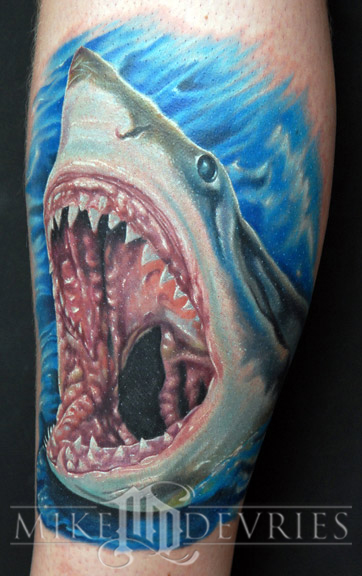 Shark tattoos, though not a popular design element, is a striking 