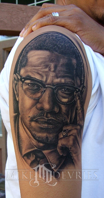 malcolm x gun. Malcolm X, tattooed on his