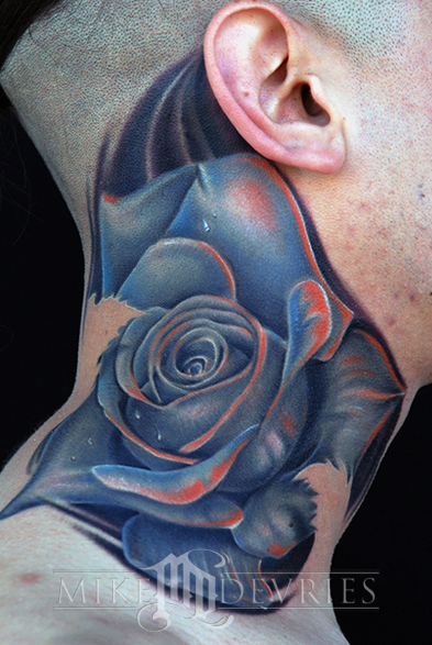 design art tattoo,rose tattoo,lower back tattoo