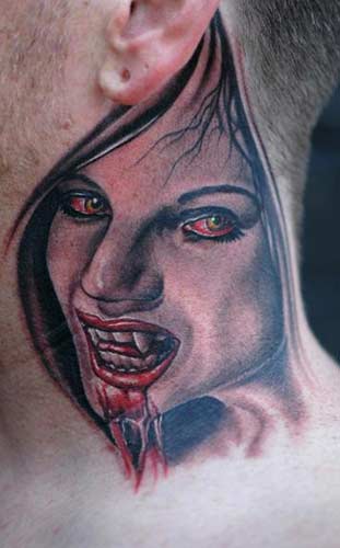 Female Vampire Tattoo on leg cross necklace tattoo