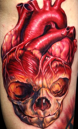 Looking for unique Tattoos? Fetus Skull Human Heart Tattoo