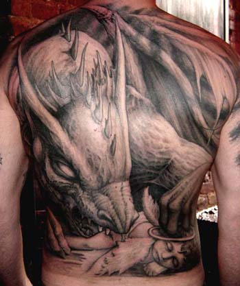 Dragon eating an angel tattoo. Placement: Back