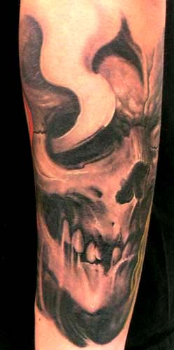 evil skull tattoo. Skull tattoo