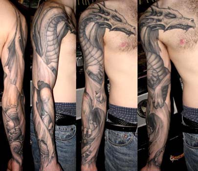 Comments: Custom black and gray sleeping winged dragon arm sleeve tattoo