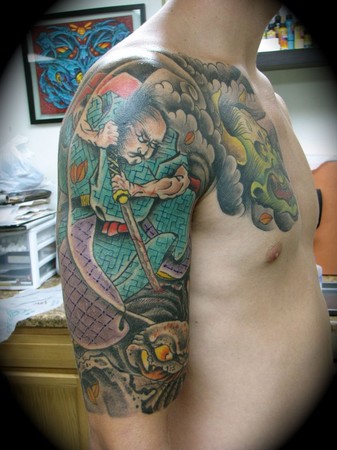 Kike Castillo samurai killing a evil spider tattoo