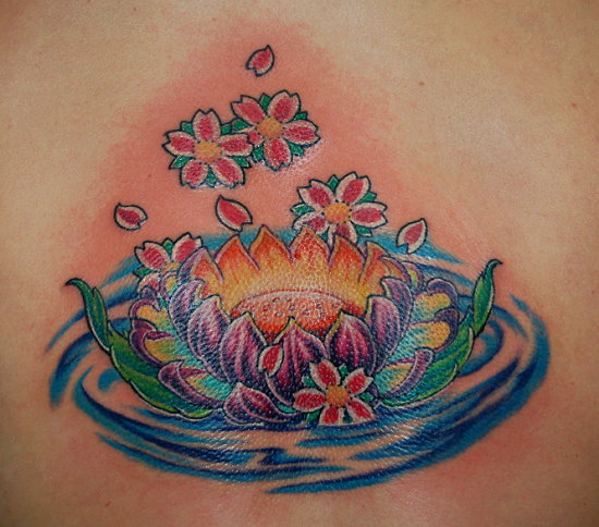 Cherry Blossom Tattoo and Lotus Tattoo Design on Female Lower Back