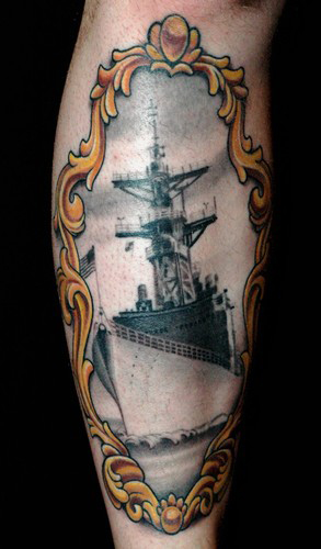 Russ Abbott - Battleship tattoo in a Victorian frame.