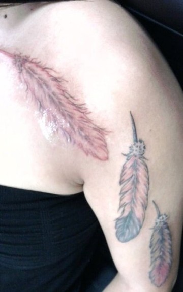 Three feather tattoo