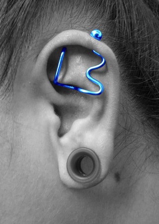 black industrial piercing. An industrial piercing