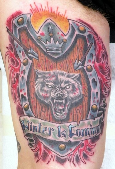 Wolf and shield tattoo