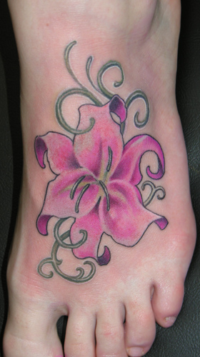 Lily flower tattoo designs for women. A stylized lily is still regarded as