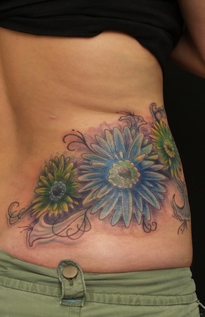back tattoos of flowers. on side of ack tattoo