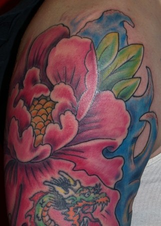 Comments: Josh's tattoo sleeve includes dragons, a geisha, plenty of flowers 