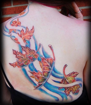 Comments: this is a tattoo of fall leaves falling across a back.