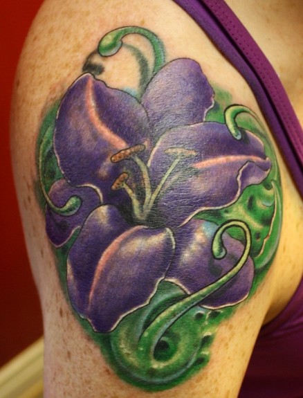 Ty McEwen - lilly flower tattoo