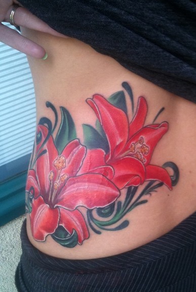 lilly tattoo. Placement: Arm Comments: some lillys with swirlies. about 5 