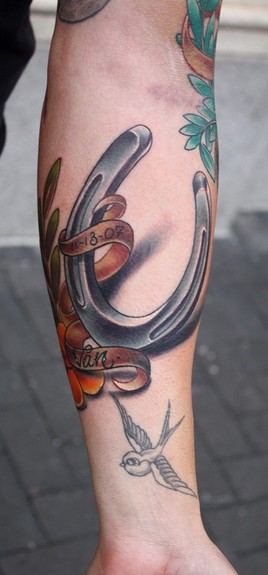 Ty McEwen - horse shoe tattoo