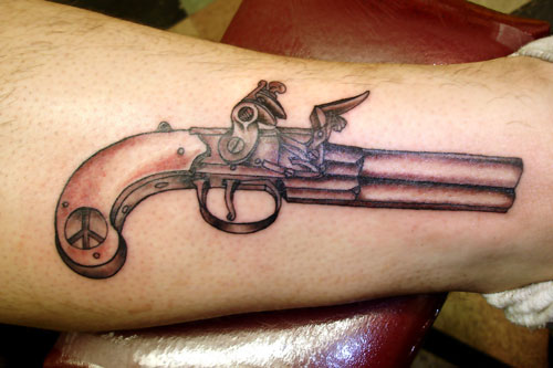 revolver tattoos. pistol tattoos. pistol tattoos