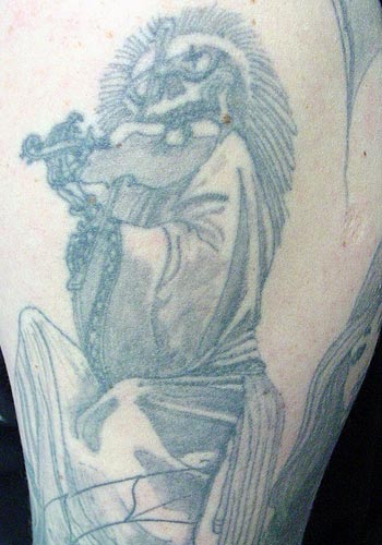 Bad Tattoos - Skull playing violin. Leave Comment