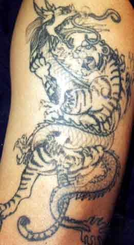 Really bad tattoo - tiger and dragon. Leave Comment