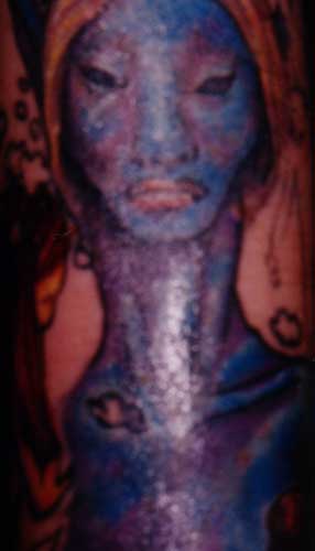 Really bad tattoo - Blue face. Leave Comment